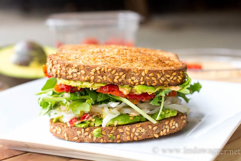 Vegan Hummus, Avocado, and Sun-dried Tomato Sandwich 
