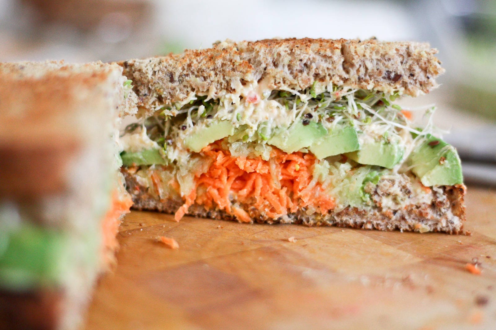Hummus, Carrot, Cucumber, Avocado, and Sprouts Sandwich