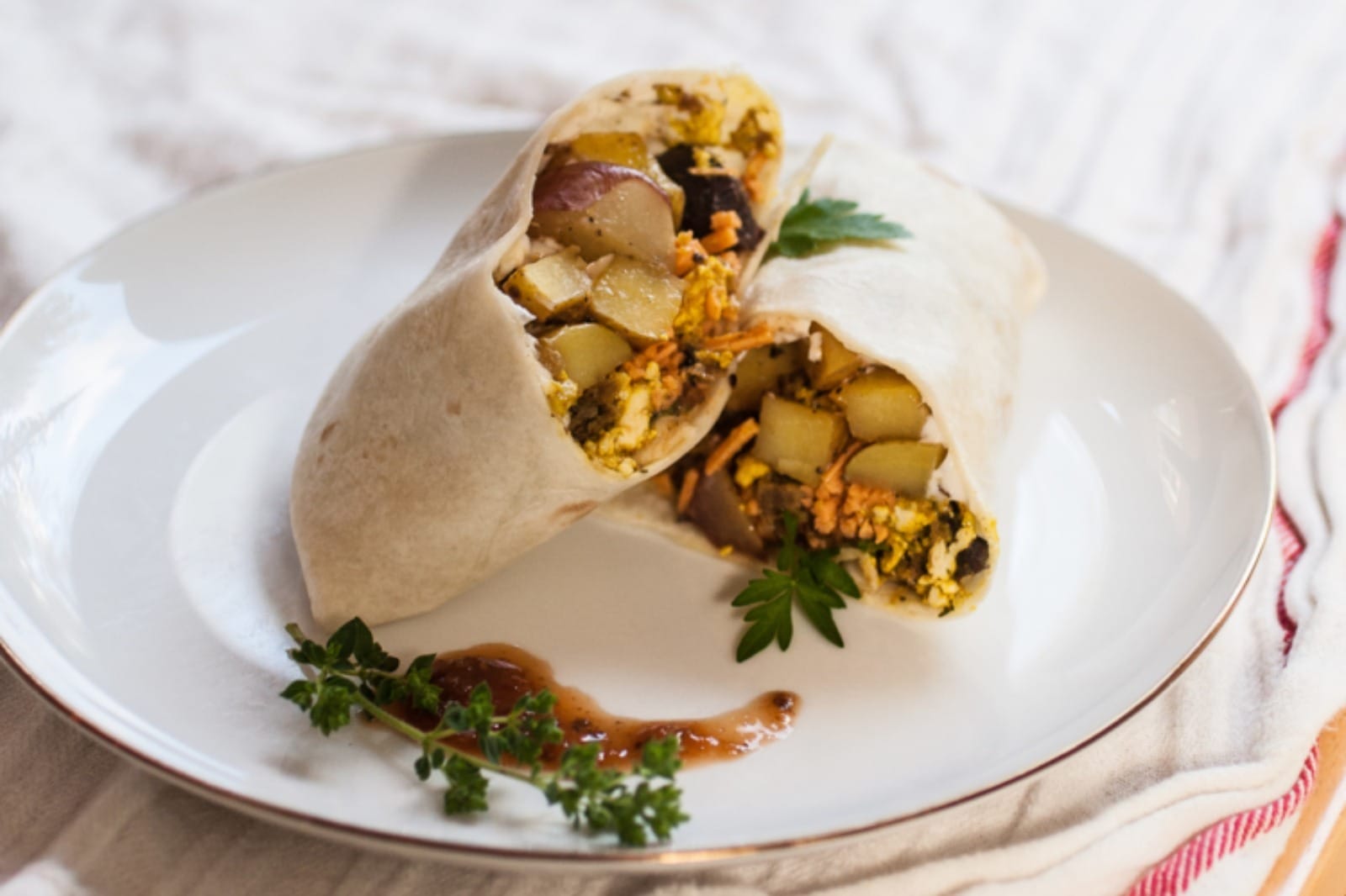 Vegan Breakfast Burritos with beans, potatoes, veggies, and tofu scramble