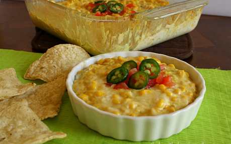 Dairy free queso in a dish with chips on the side