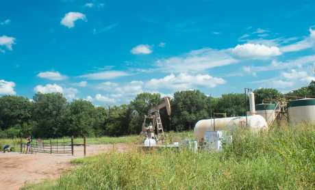a fracking site where an oil pump jack is operating in Oklahoma
