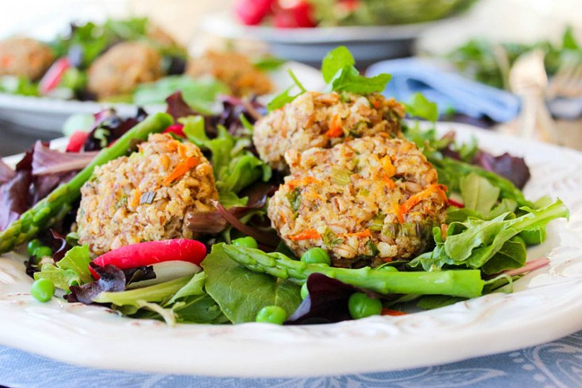 Spring Onion Farro Fritters With Fresh Peas, Asparagus, Radish and Tahini Mint Dressing [Vegan]