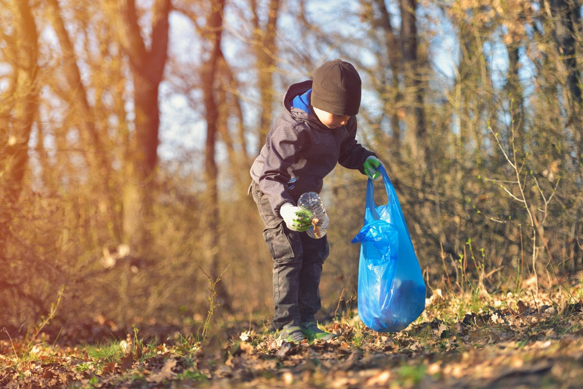 kid picking up trash