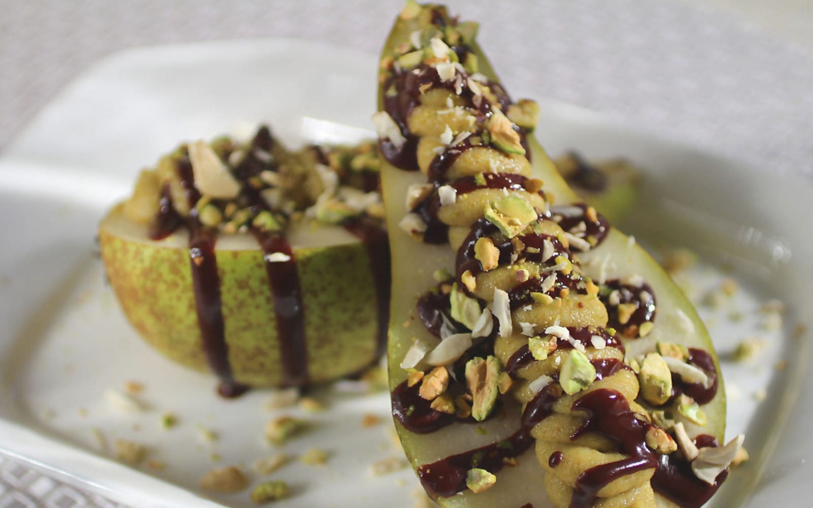 Pear With Pistachio Mousse and Raw Chocolate Sauce