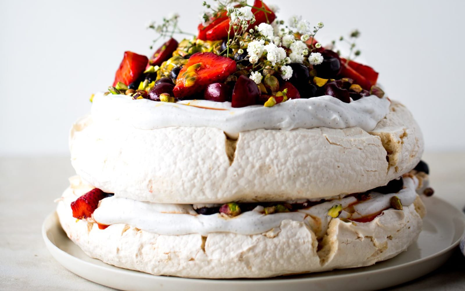 Pavlova With Saffron Berries Passionfruit and Pistachios b
