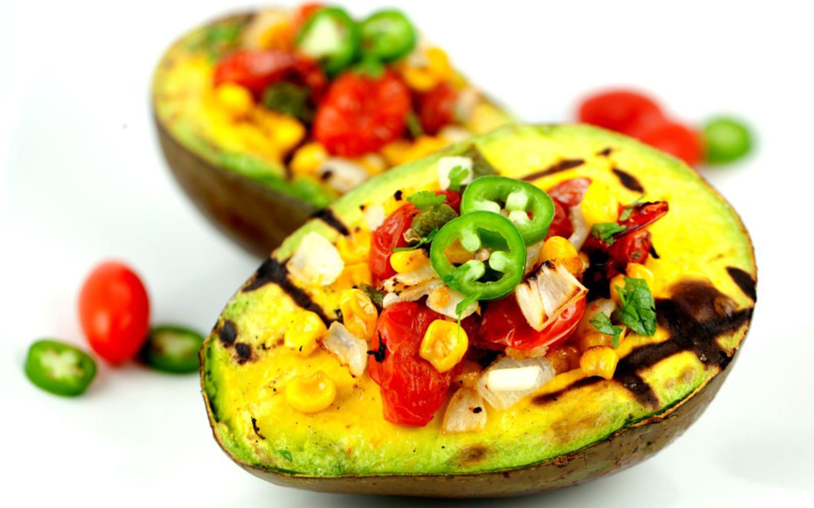 Grilled avocado with roasted tomatoes