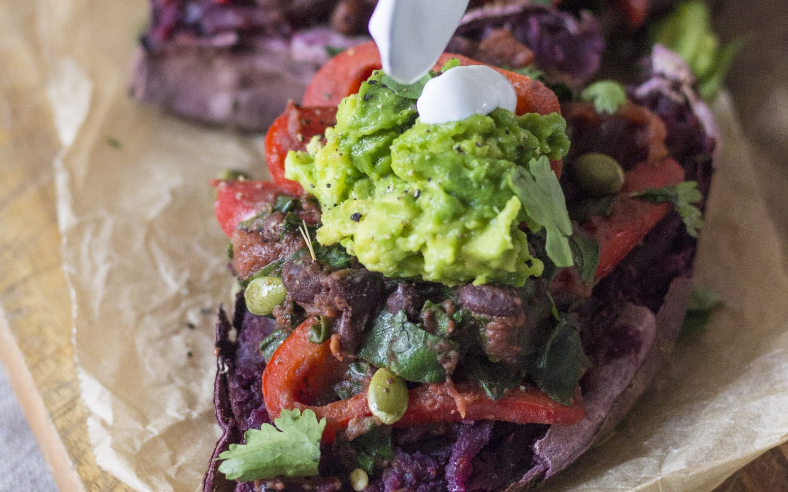 Vegan, Grain-Free Black Bean Chili Stuffed Sweet Potatoes with guacamole