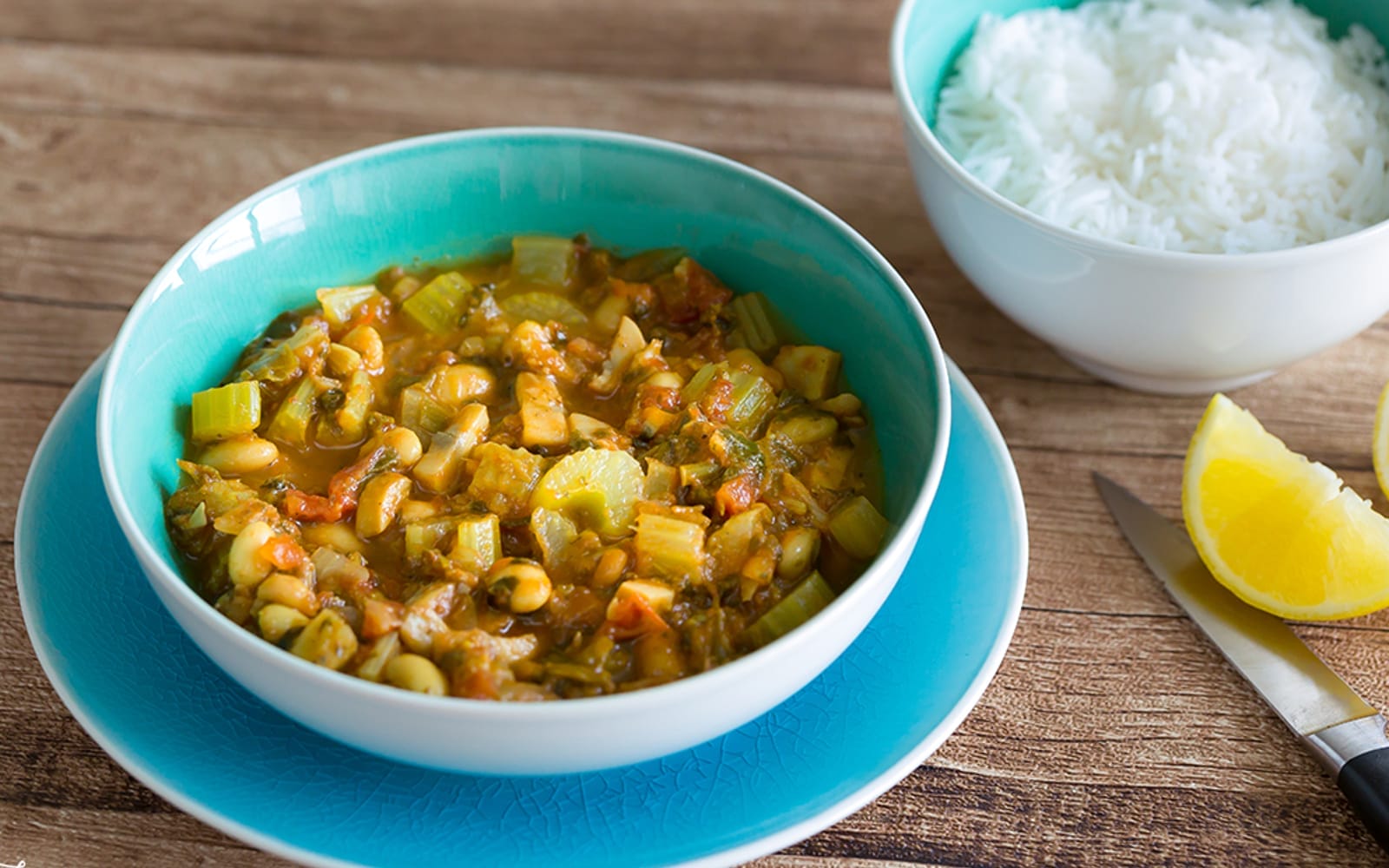 Vegan Grain-Free Celery, Mushroom, and White Bean Stew with lemon wedge