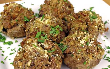 Vegan Sausage Stuffed Mushrooms topped with herbs and spices