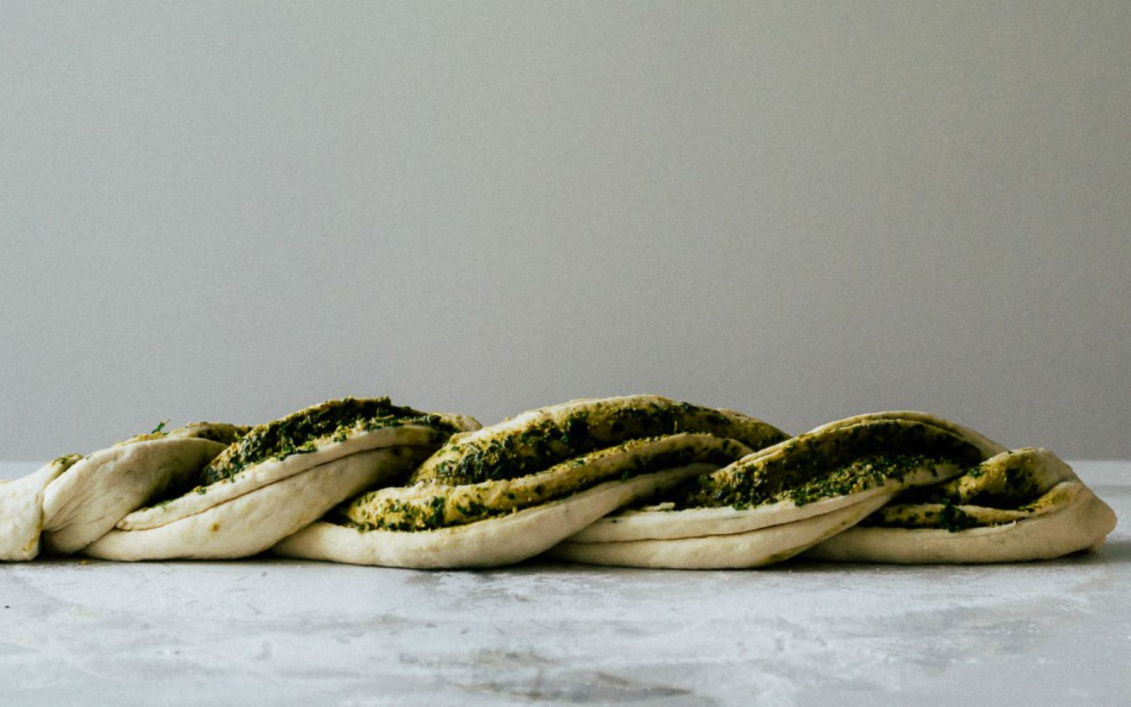 Vegan 6-ingredient Twisted Pesto Bread side view