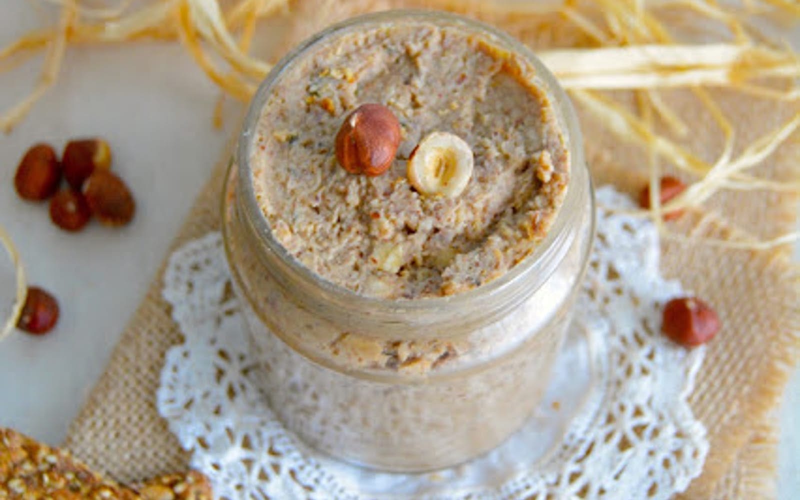 Vegan Savory Chestnut Spread with Hazelnuts in a jar topped with nuts