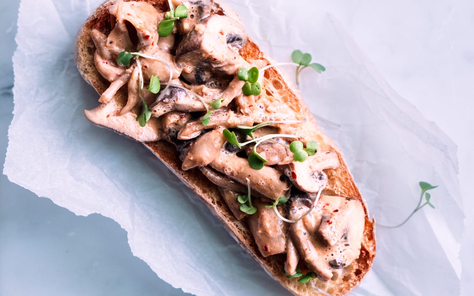 Vegan soy-free nut-free Red Curry Mushroom Toast topped with greens