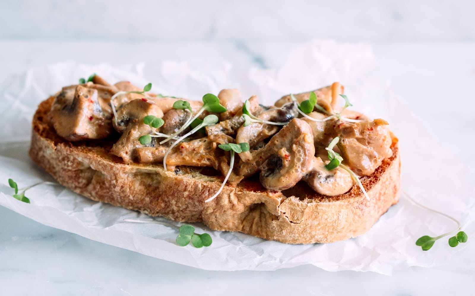 Vegan soy-free nut-free Red Curry Mushroom Toast topped with greens