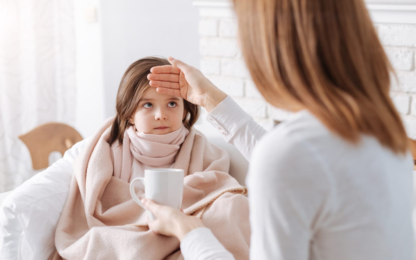 Mom with sick child with Flu