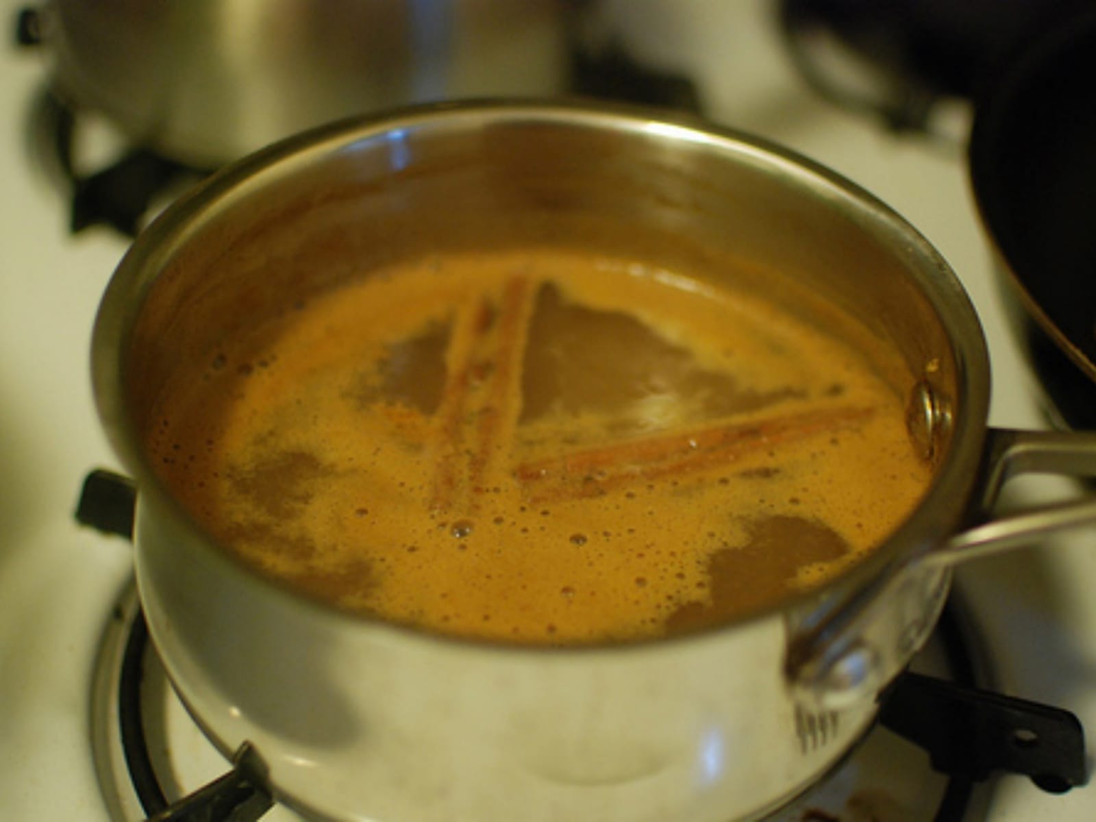 Spiced and Spiked apple cider in saucepan