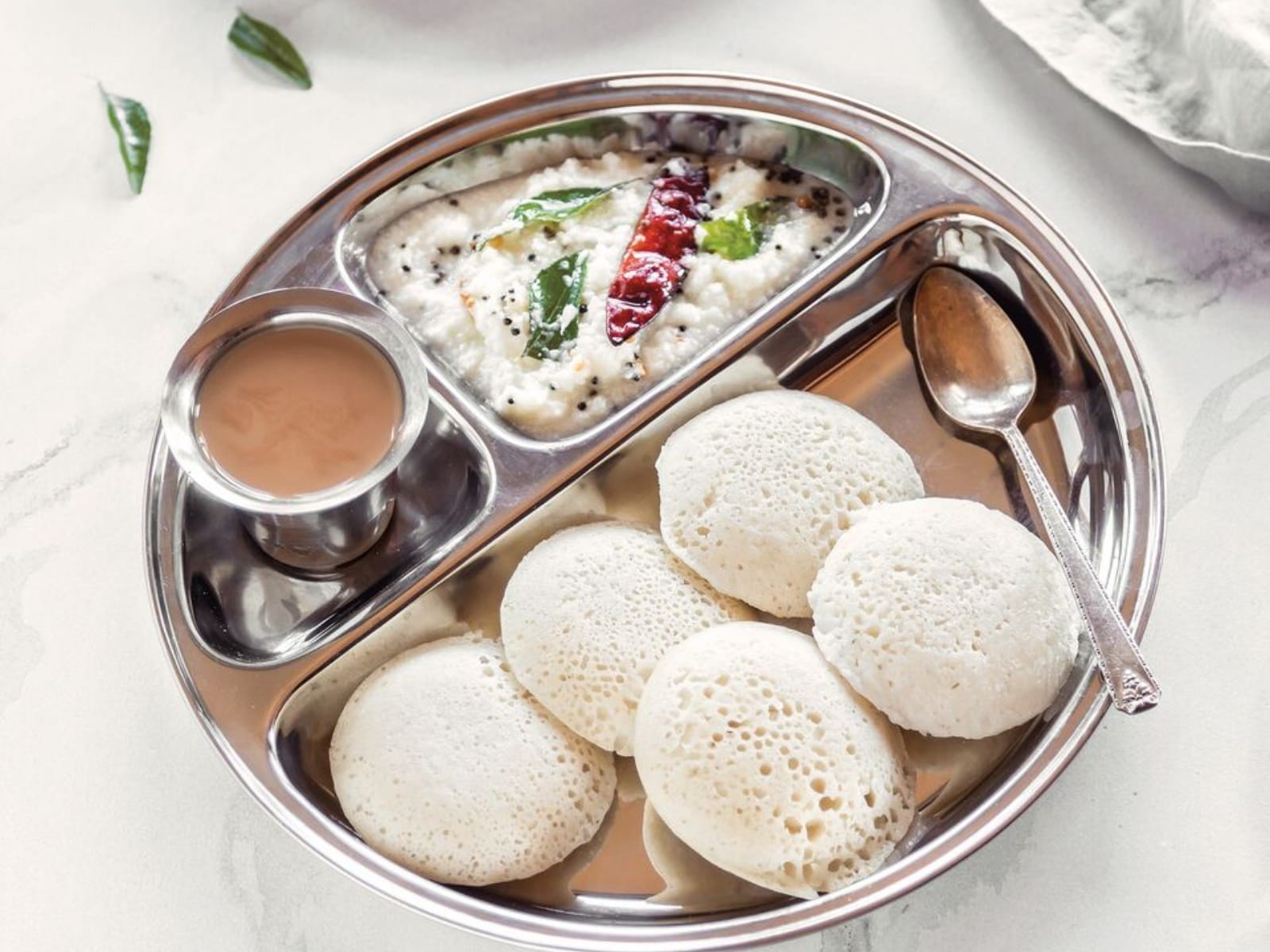 idlis: steamed rice lentil cakes with coconut chutney