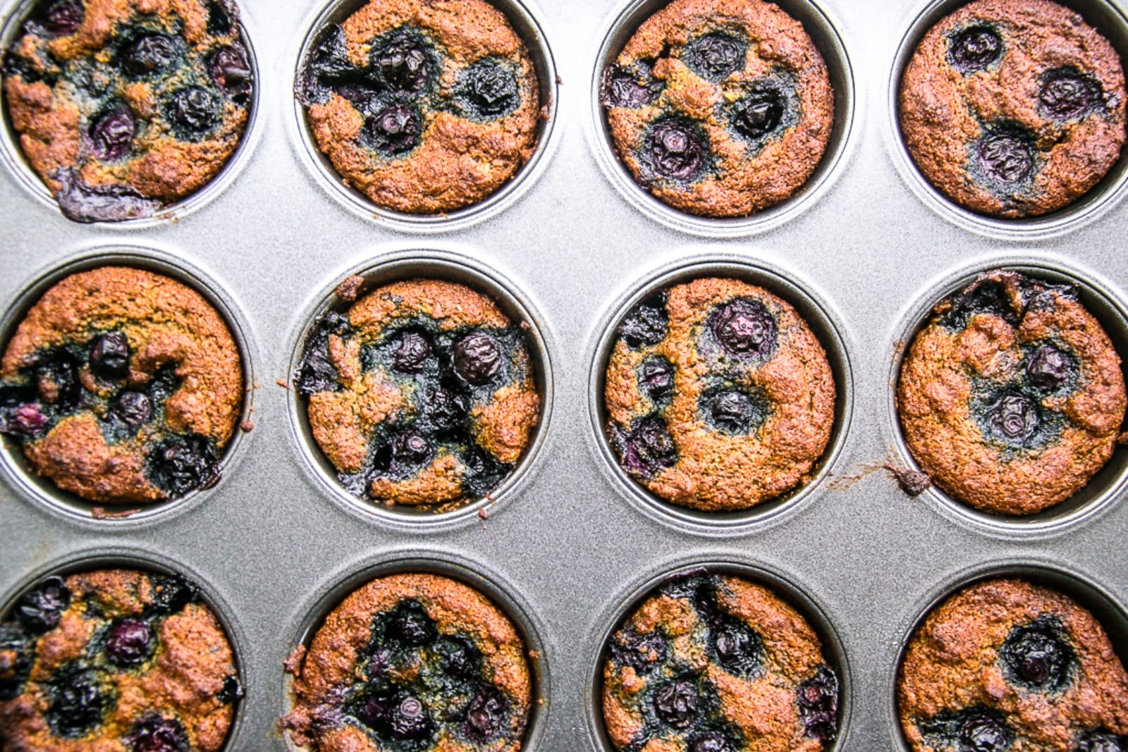 blueberry chia muffins in tin