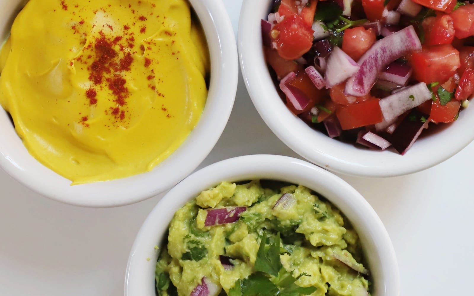 vegan taco toppings- guac, salsa, cashew nacho cheese