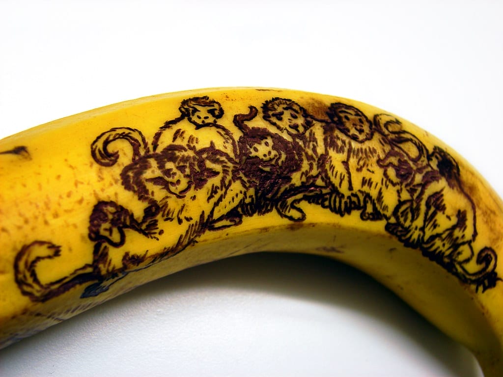 Banana with monkeys drawn on it