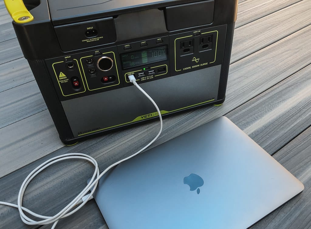 Solar generator charging a laptop