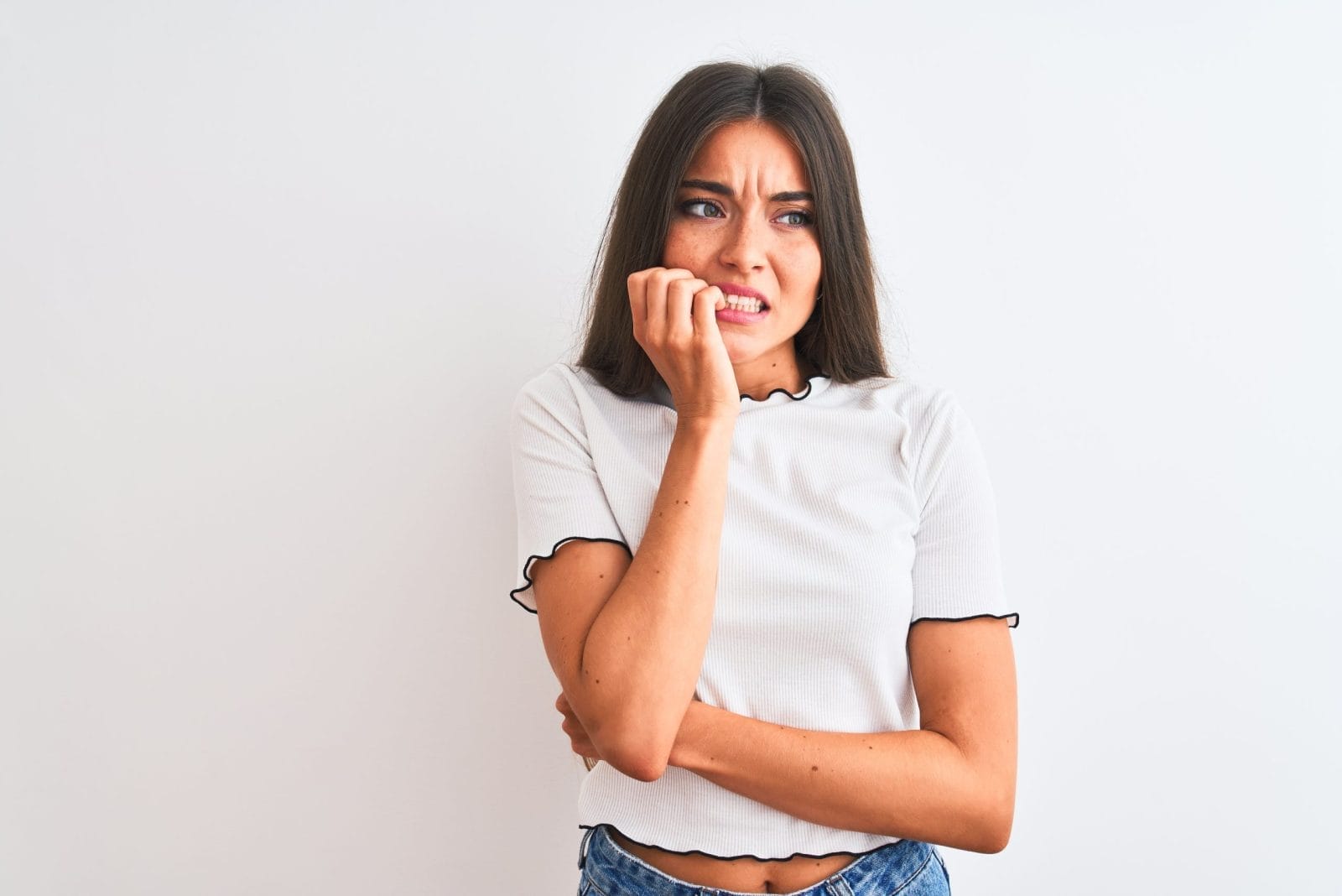 woman nervous biting her fingernails