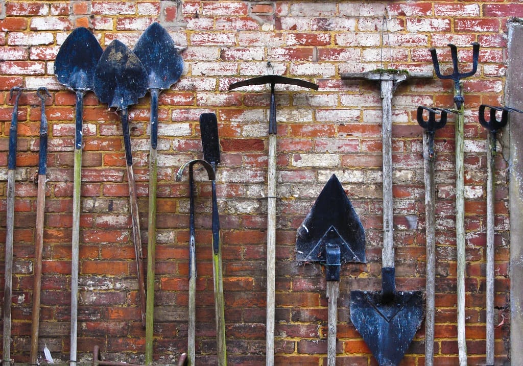 Garden Tools against a brick wall