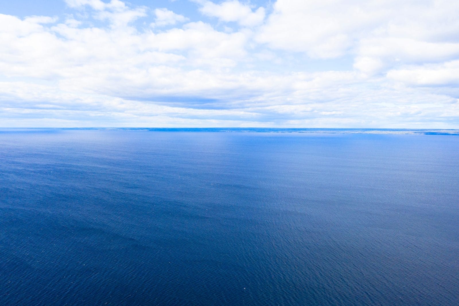 Aerial view of a blue sea water background