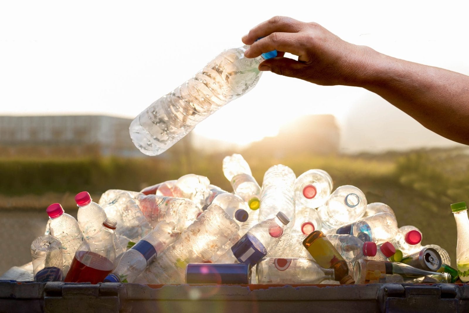 Hand holding recyclable plastic bottle