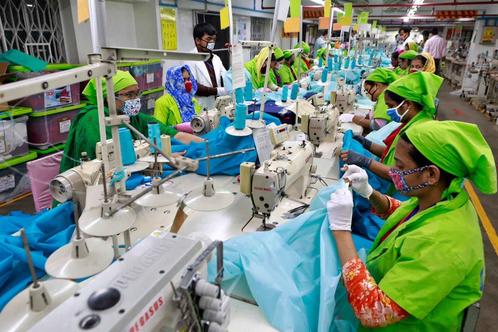 Workers producing personal protective equipment