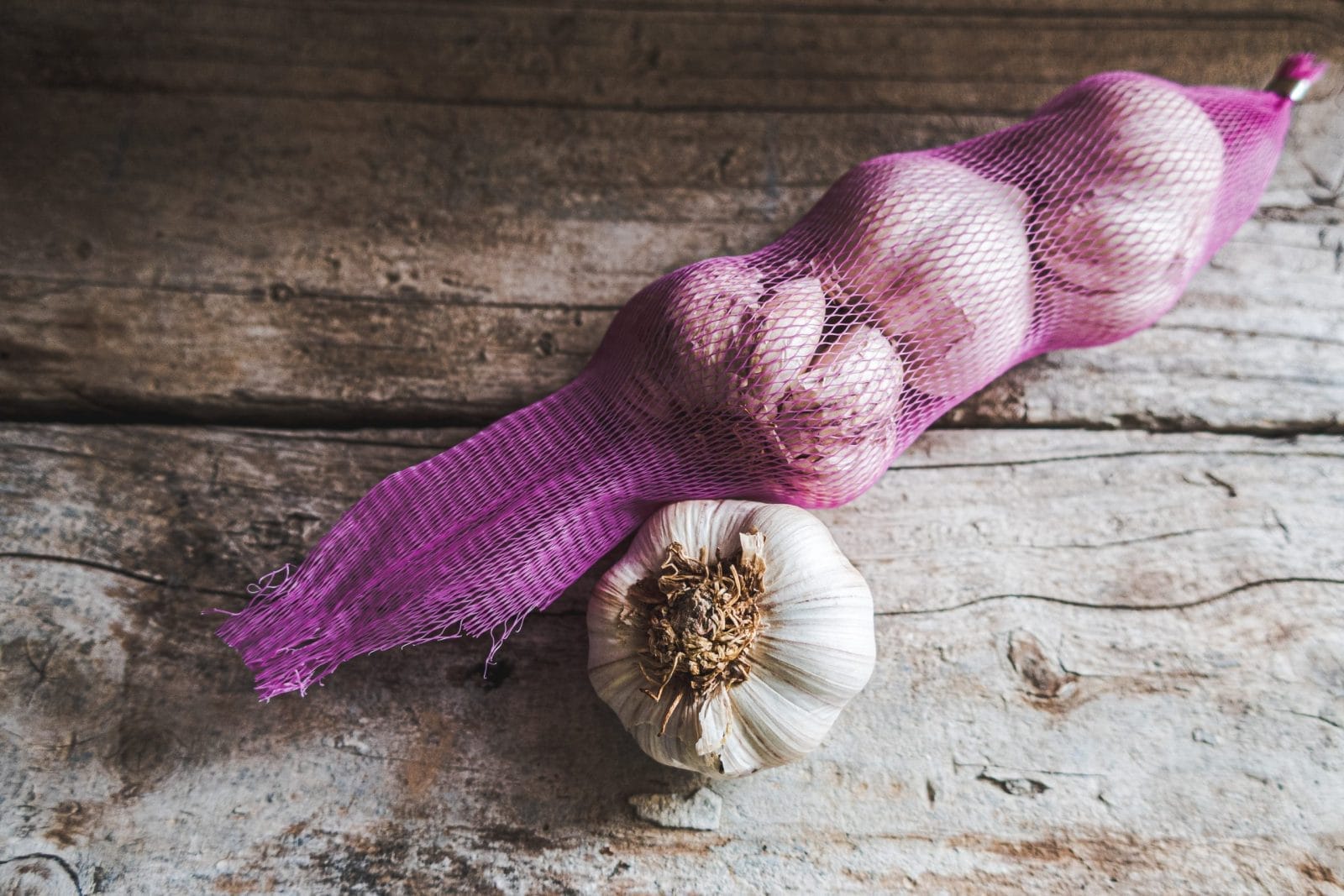 garlic wrapped in plastic mesh