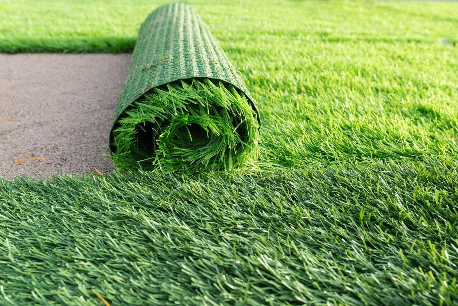 Green artificial grass soccer field