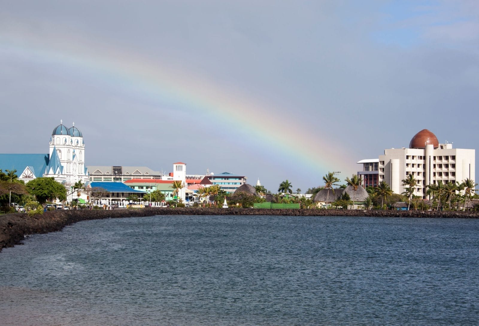 The morning view of Apia downtown and a sky with a rainbow