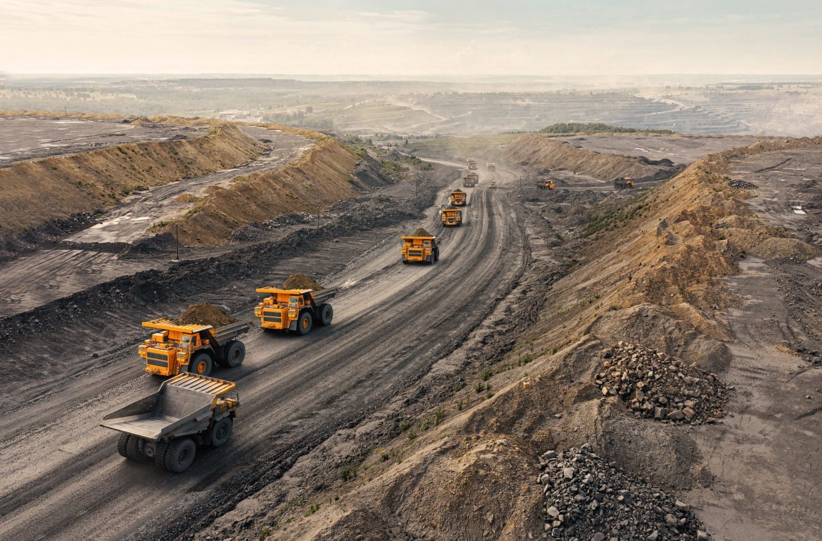 Big yellow mining truck at work site