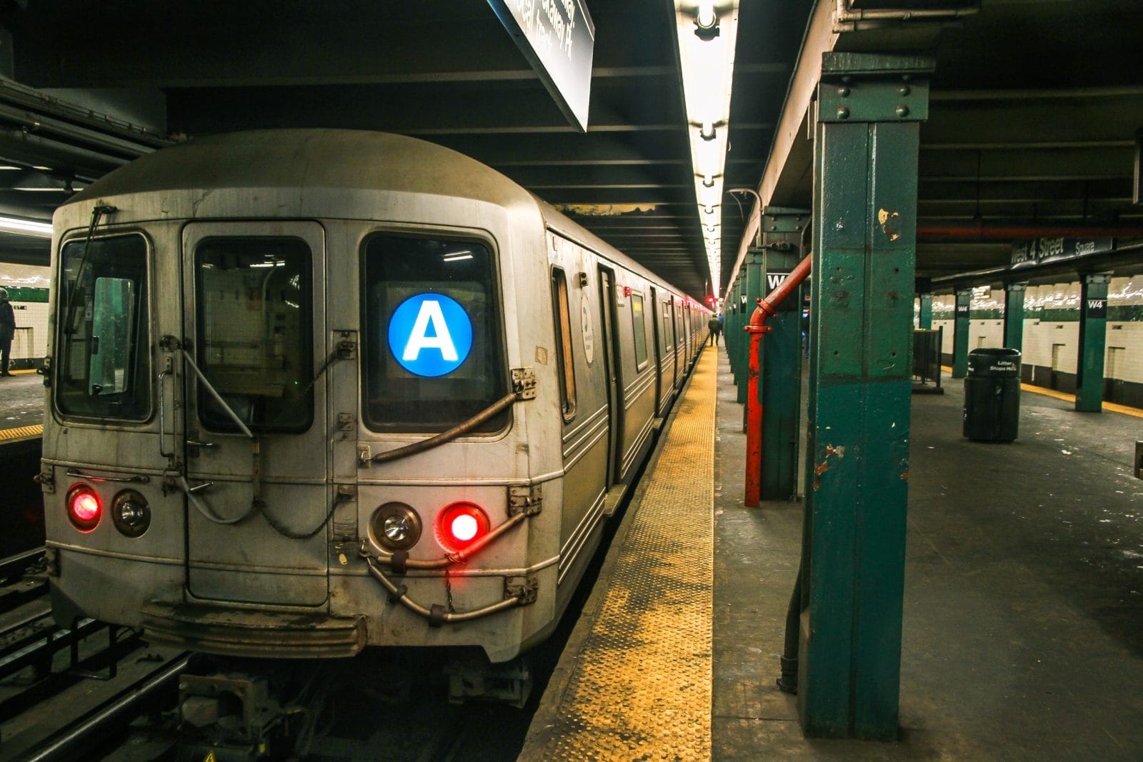 subway train stopped at a station NYC