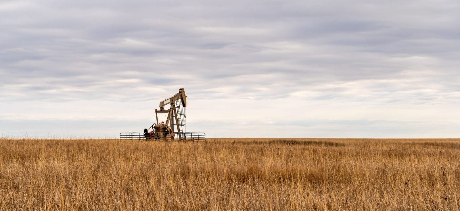Oil Well Pump Jack pumping crude oil for fossil fuel