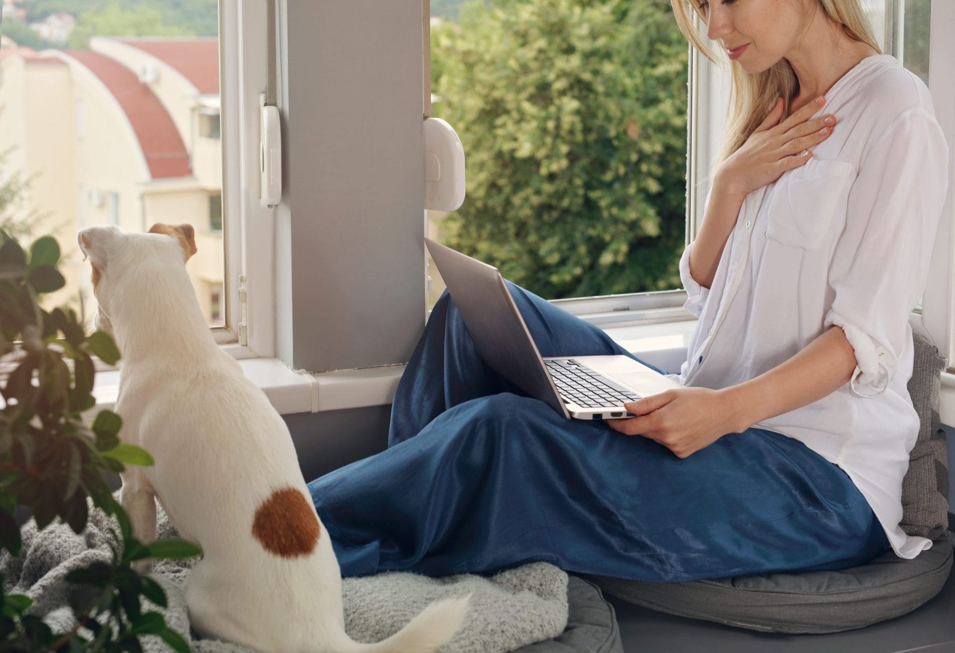 Woman communicating with someone on her laptop