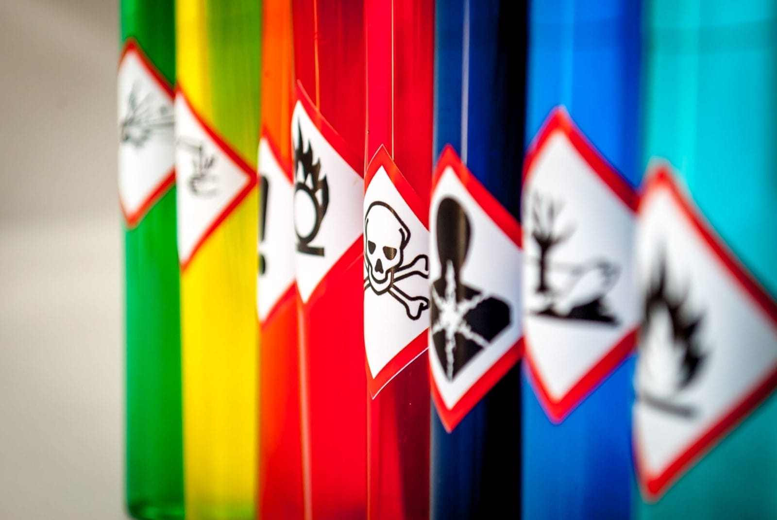 colourful toxic chemicals labelled with danger symbols