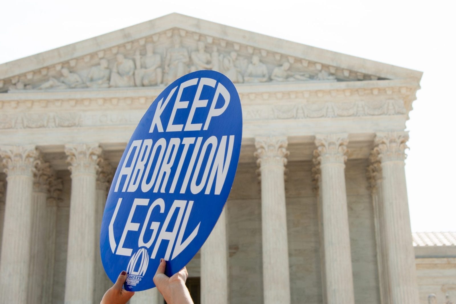 Someone holding a keep abortion legal sign