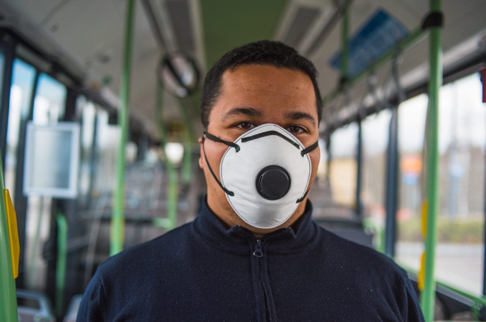 Man wearing mask in a bus