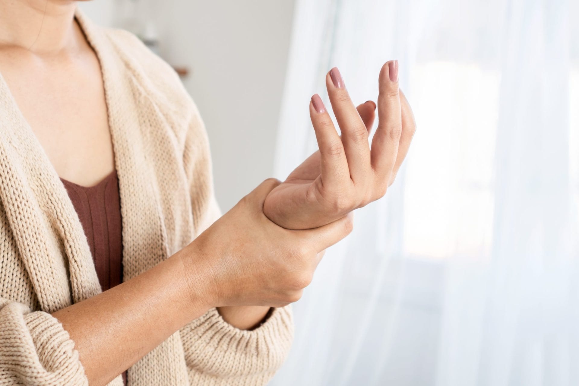 Woman holding her wrist