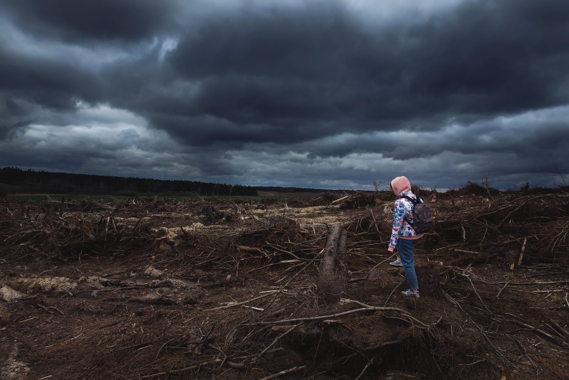 Girl standing on the ruins of a village