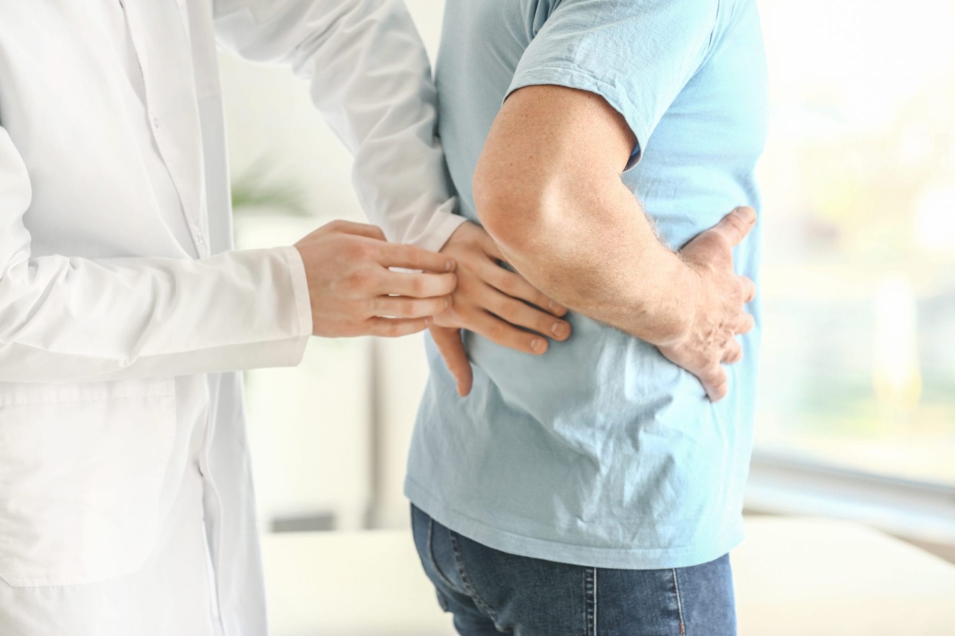 Urologist examining patient