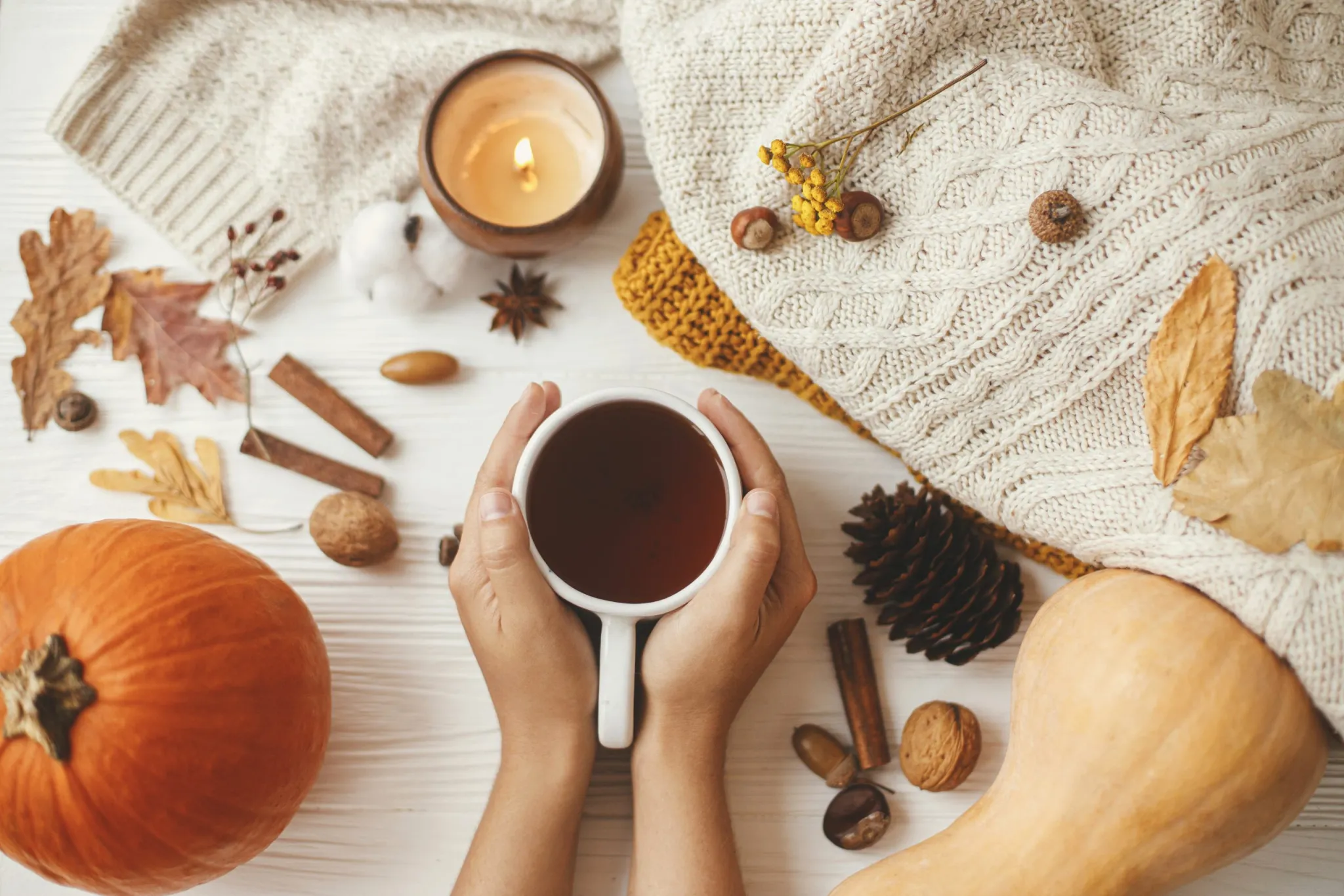 Someone holding a cup of coffee