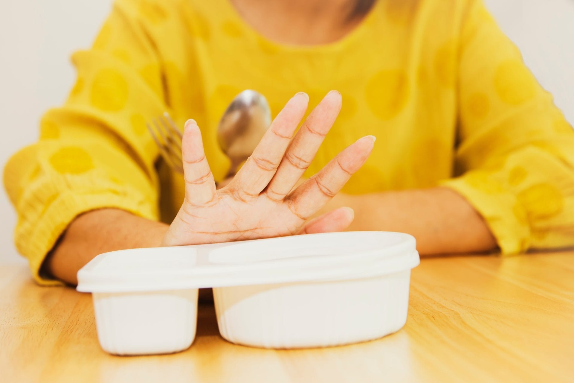 Woman refusing to eat food
