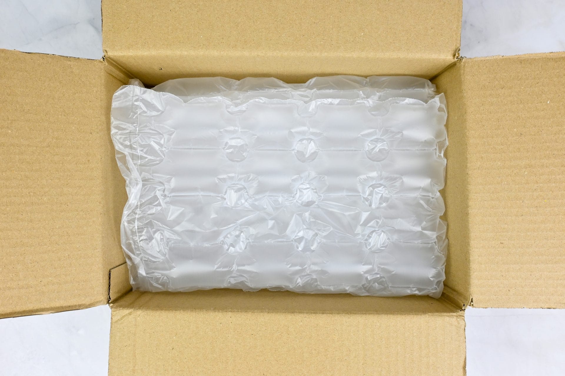 Cardboard box filled with plastic bubble wrap