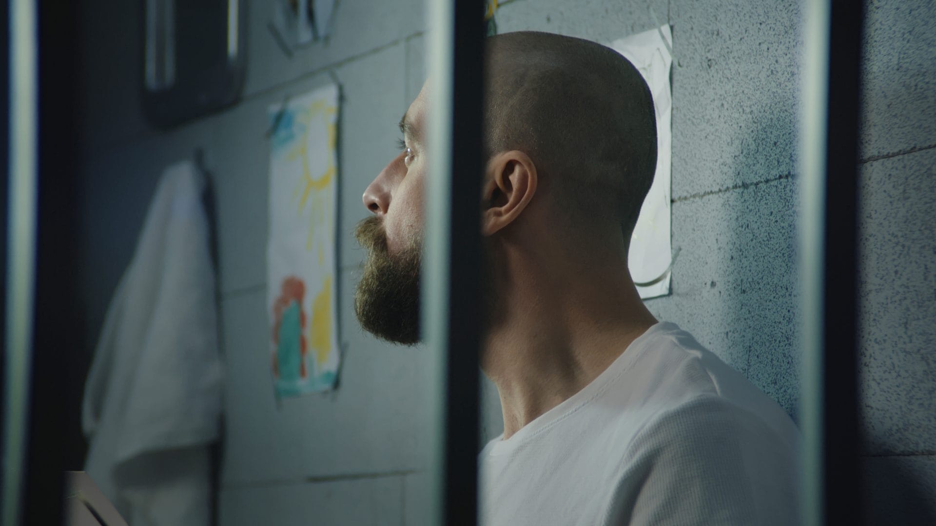 Man sitting in jail cell