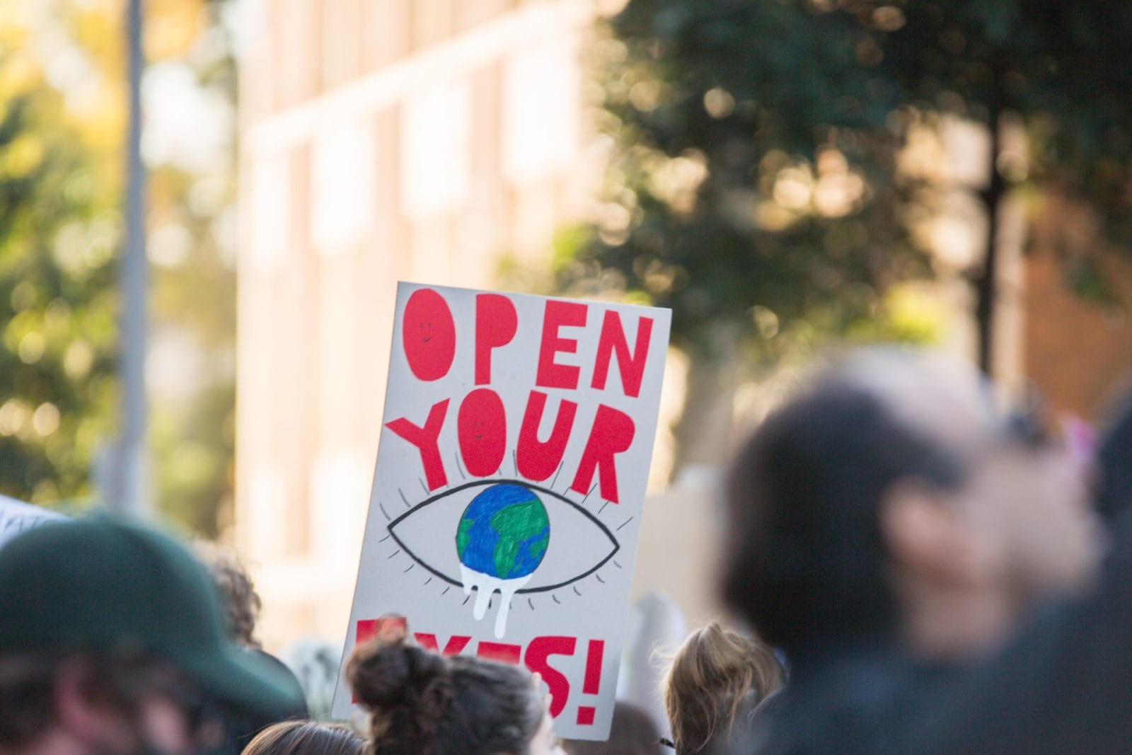 Someone holding sign at climate rally