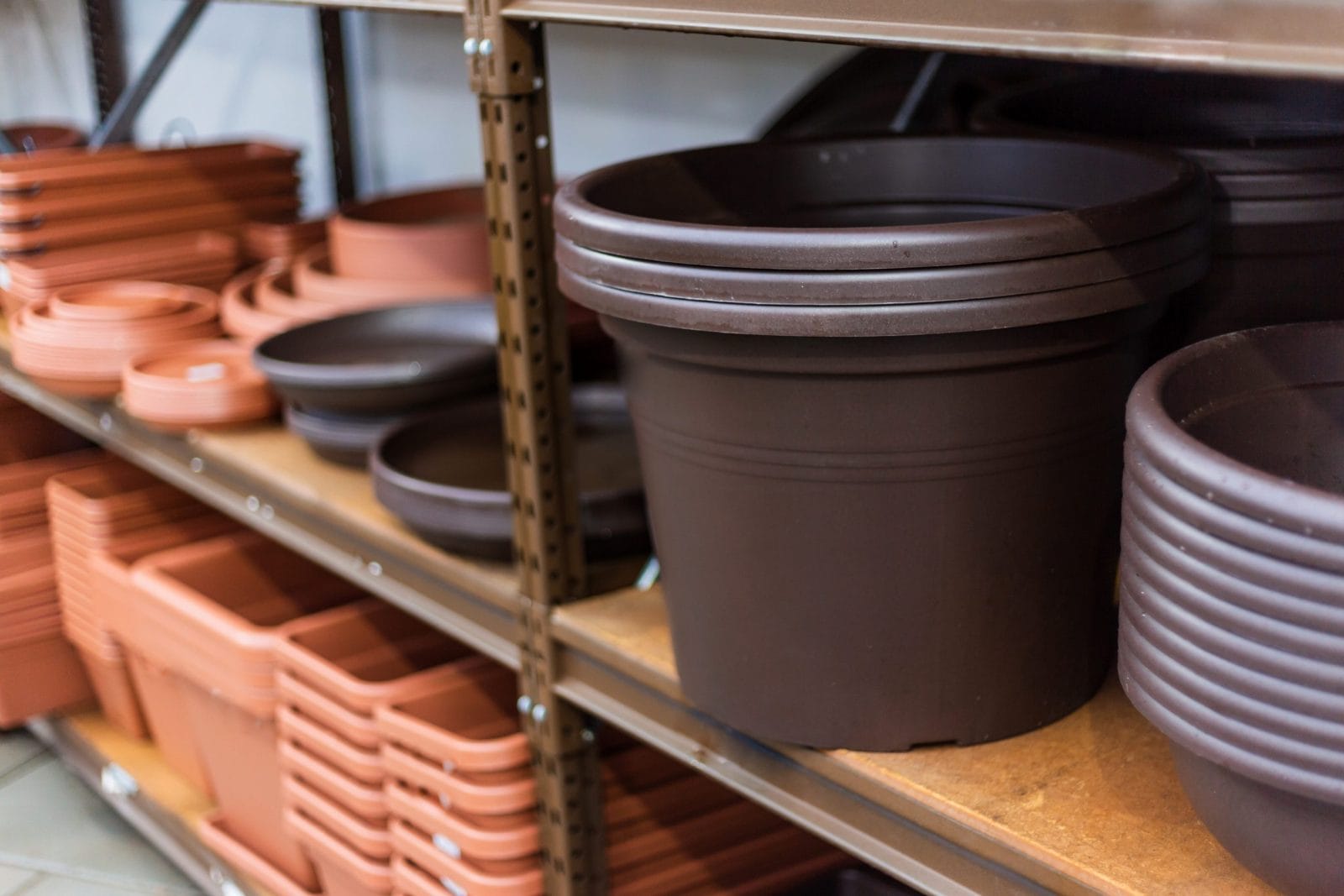 Stacked plastic pots for planting at sale in a garden center